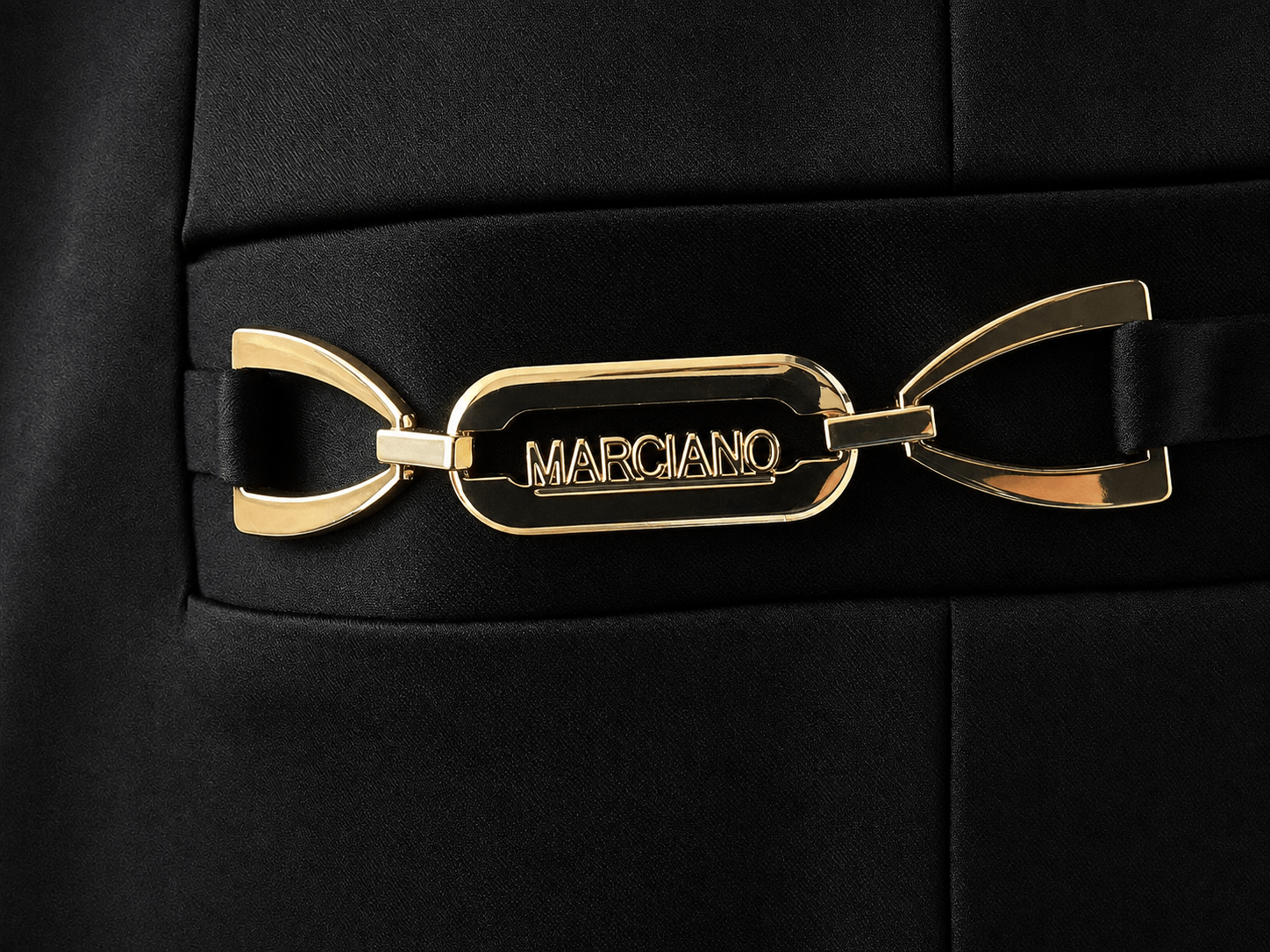 Gold logo detail on the Marciano by Guess Satin Finish Blazer – Black, a luxury women's fashion piece from premium brands.